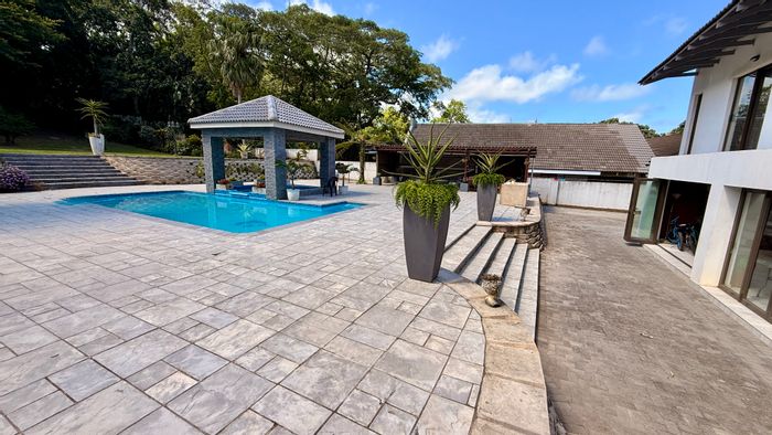 Spacious Umtentweni house for sale with pools, flatlet, and ample parking.