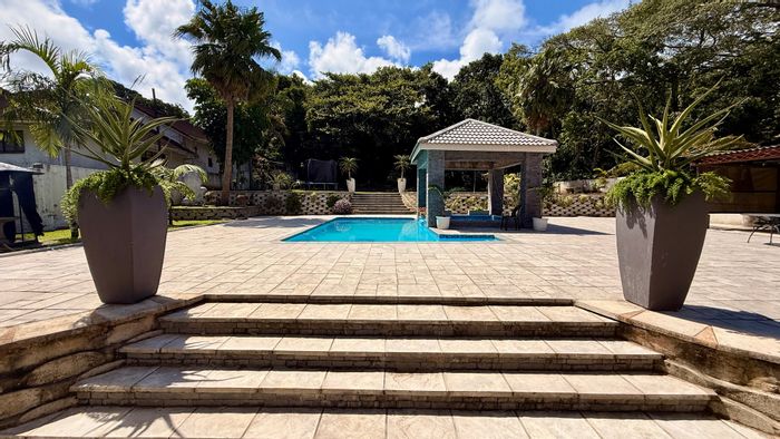 Spacious 5-bedroom house in Umtentweni with pools, flatlet, and ample parking. For Sale.