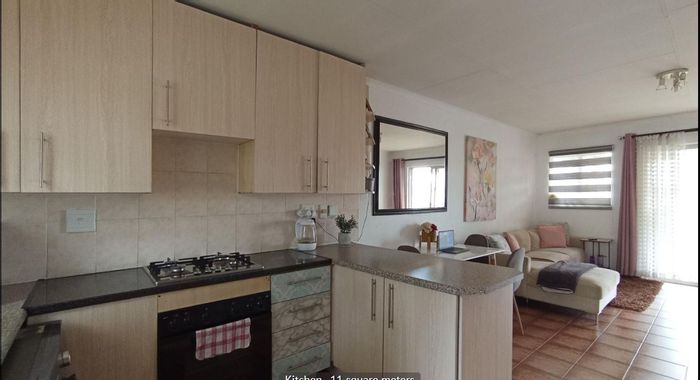 2-Bed Apartment For Sale in Aloe Ridge Estate with pool, clubhouse, and patio.