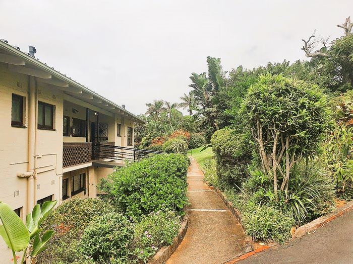 For Sale: Umtentweni Apartment with 2 bedrooms, garage, ocean views, and beach access.