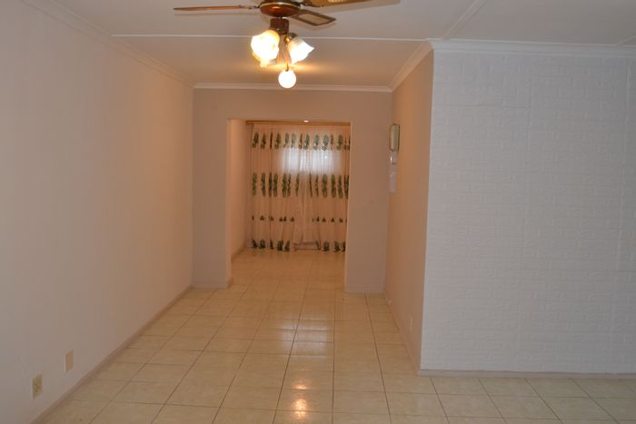 House for Sale in Strandfontein: 4 bedrooms, flatlet, garage, and garden.