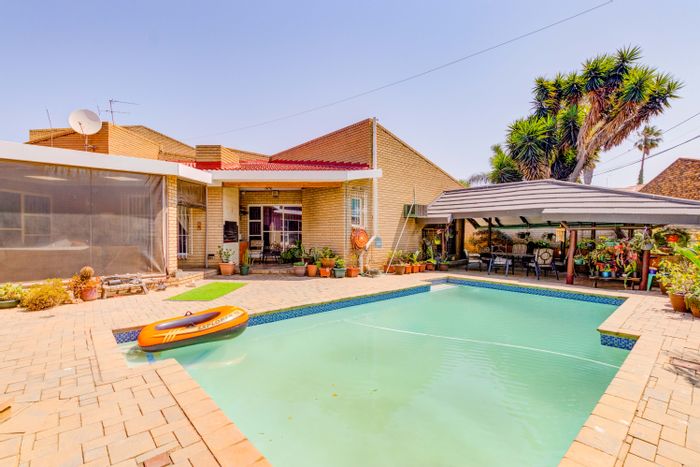 For Sale: Spacious 5-bedroom house in Sunward Park with pool, bar, and cottage.