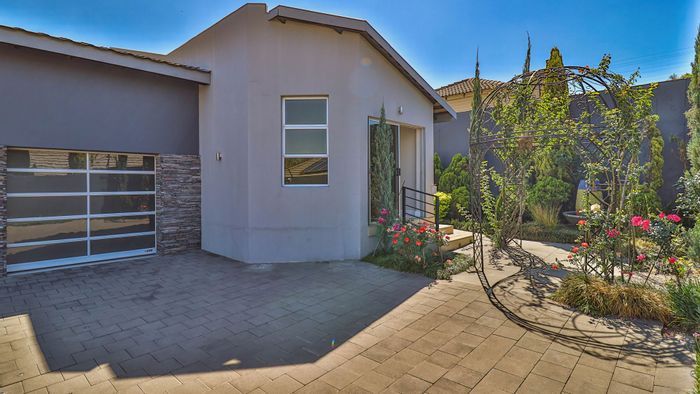 For Sale: Spacious Douglasdale house with 13-car garage, pool, and office suite.