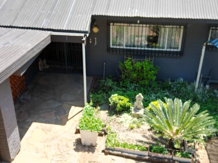 For Sale: House in Meyerton Central with spacious grounds and income-generating cottages.