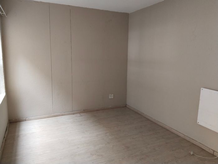 Northcliff Townhouse For Sale: 2 beds, panoramic views, open-plan living, garden.