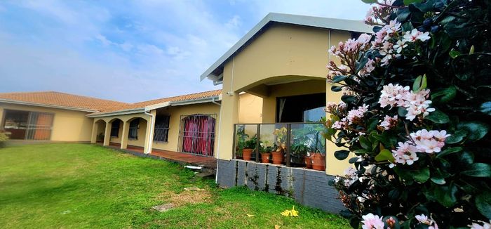 For Sale: House in Uvongo Beach with ocean view, pool, and guest cottage.