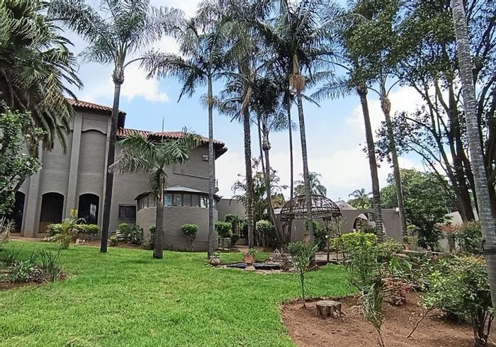 For Sale: Spacious Waterkloof Heights house with pool, squash court, and lush gardens.