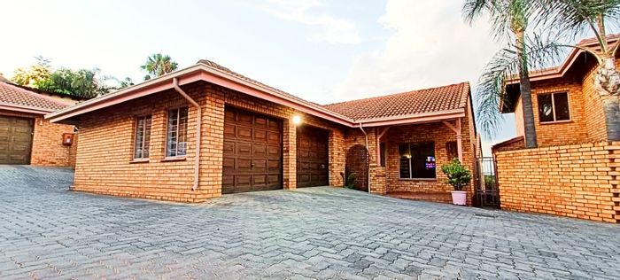 Spacious Silverton townhouse with private garden, double garage, and secure living. To Rent.