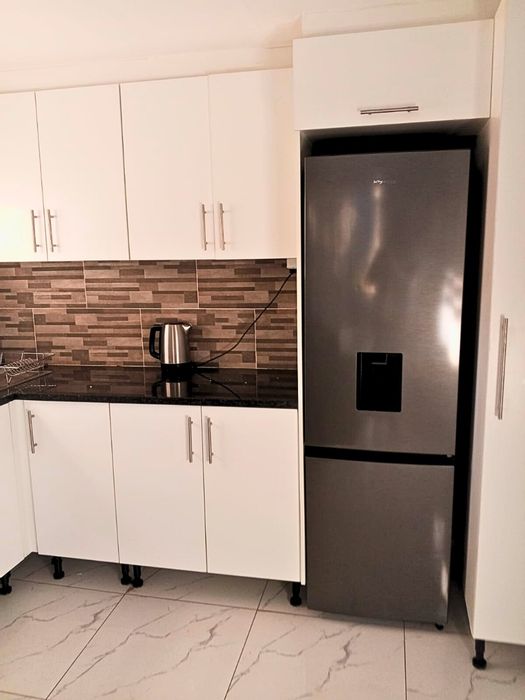 Sandown Estate Townhouse To Rent: 1 bed, 1 bath, 2 garages, secure living.