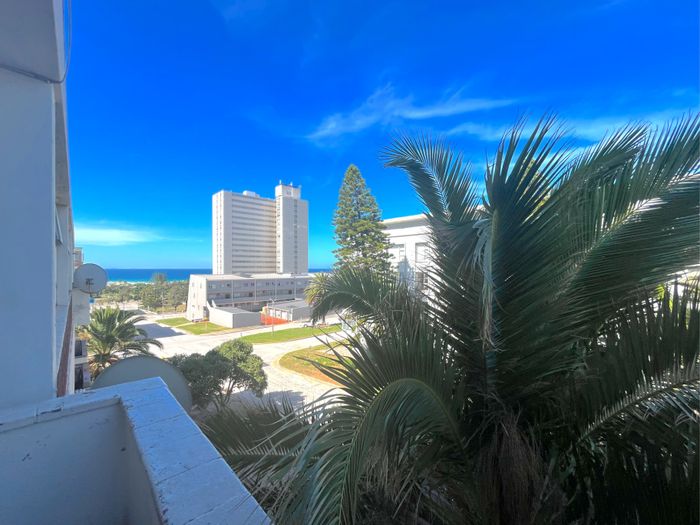 Beachfront Apartment in Humewood For Sale: 2 Bedrooms, Balcony, Prime Location.