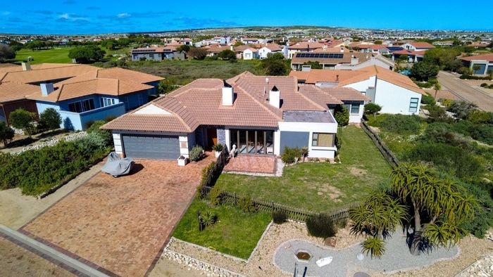 For Sale: 4-Bedroom House in Langebaan Country Estate with golf views and entertainment area.