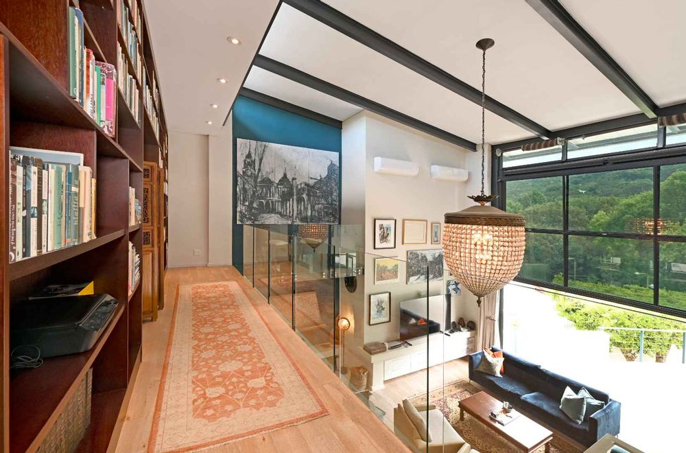 Double volume view from library to living area