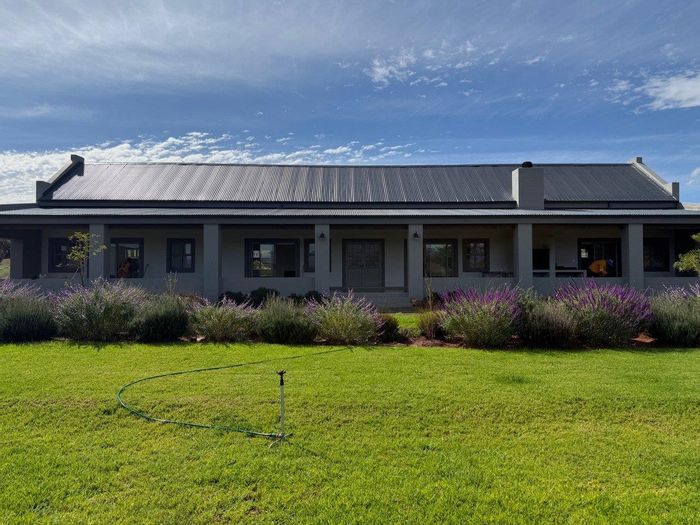 Off-Grid House for Sale in Van Wyksdorp with spacious living and beautiful gardens.