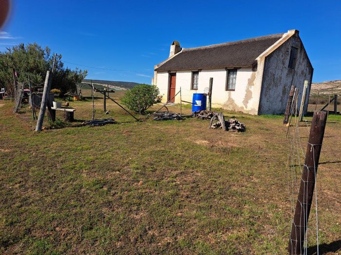 Riversdale Rural farm for sale: riverfront, arable land, off-grid potential.