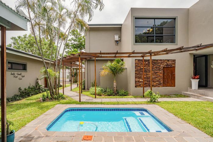 La Lucia Guest House For Sale: 5 en-suite rooms, pools, beach proximity, versatile options.