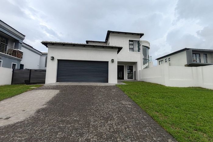 For Sale: House in Blue Valley Golf Estate with 4 bedrooms, patio, and double garage.