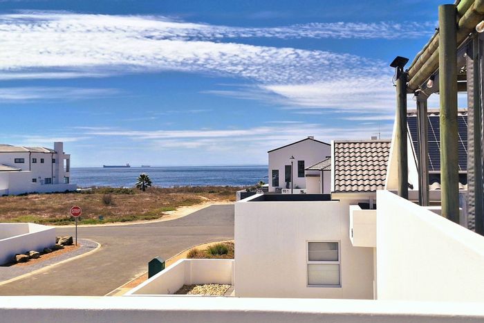 Coastal living in Sandy Point: 3 beds, open-plan design, secure estate access. For Sale.