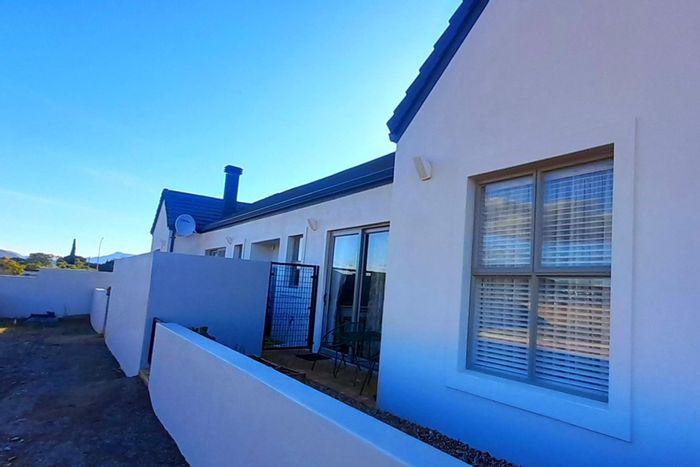 For Sale: Townhouse in Robertson Central with care services, garage, and patios.