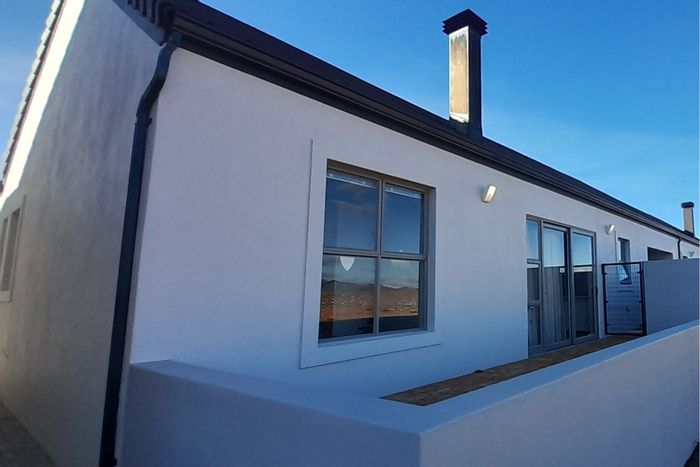 For Sale: Townhouse in Robertson Central with 2 beds, garages, and care services.