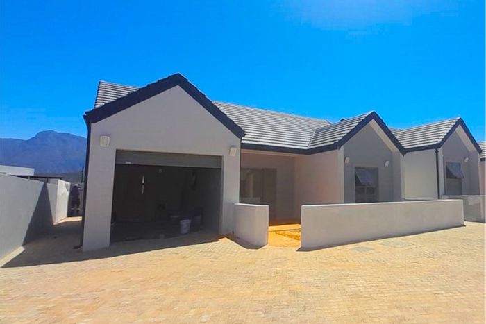 For Sale: Townhouse in Robertson Central with care services, garage, and patios.