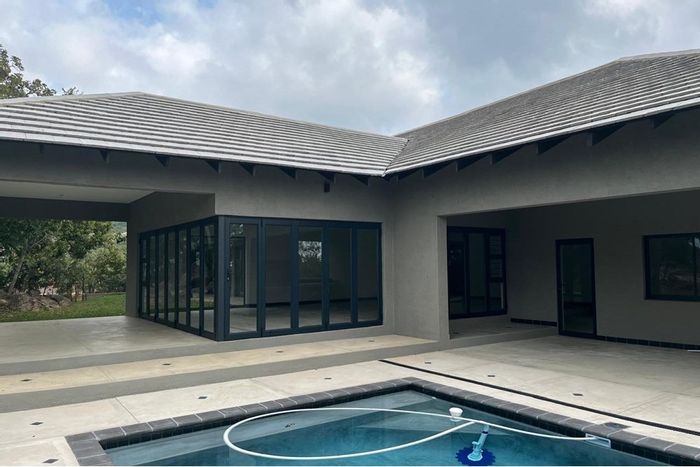 For Sale: House at The Edge - Spacious living, outdoor braai, private bedrooms.