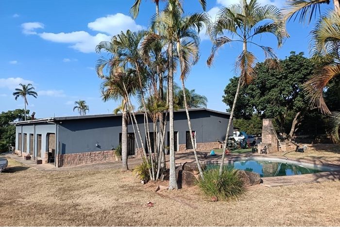 For Sale: Small Holding in White River Central with pool, garages, and river access.