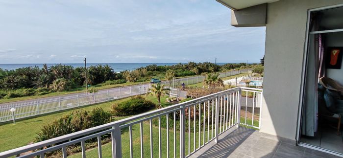 Beachfront apartment in Uvongo for sale, 180-degree sea views, secure complex.