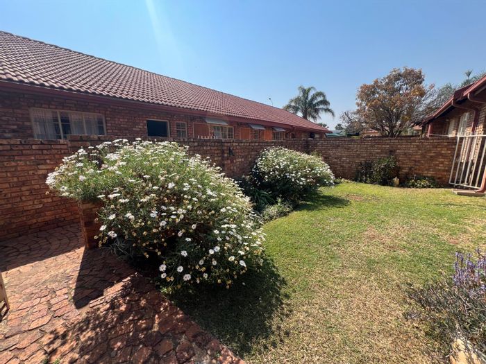 For Sale: Rooihuiskraal North Townhouse with garden, garage, and open-plan living.