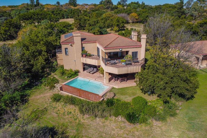 Chartwell House For Sale: Riverfront, equestrian facilities, spacious land, and security features.