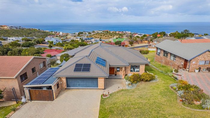 For Sale: Spacious 4-bedroom house in Dana Bay with double garage and coastal access.