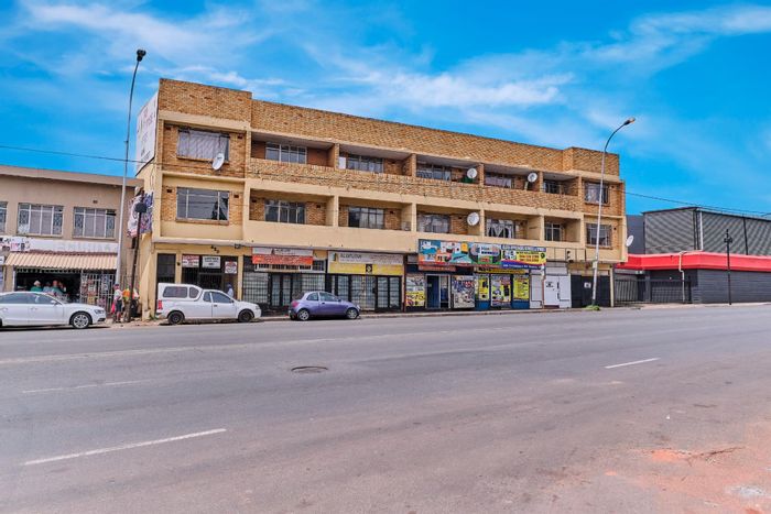 Delarey Commercial Property For Sale: 10 flats, 6 shops, high visibility location.