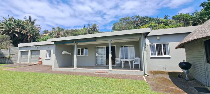 Beachfront house in Palm Beach for sale, 4 bedrooms, double garage, security features.