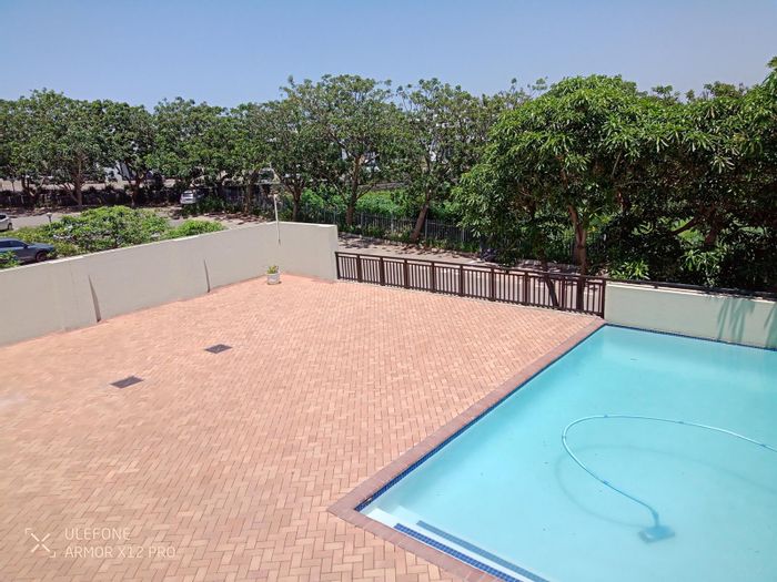 For Sale: Apartment in Umhlanga Central with balcony, laundry service, and 24-hour security.
