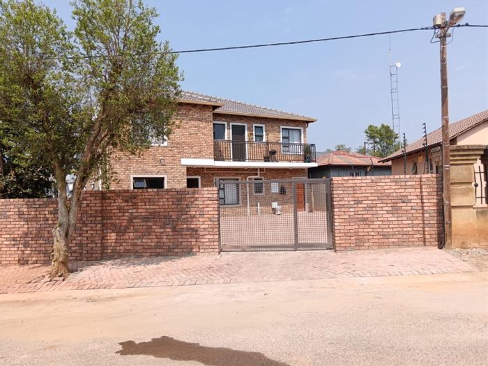 For Sale: House in Cosmo City with 12 bedrooms, secure parking, and rental income.