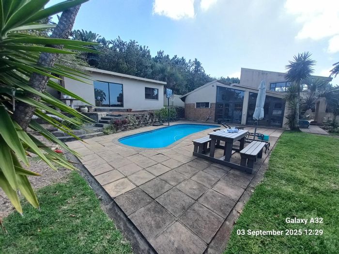 Versatile Palm Beach house for sale with pool, flatlet, and sea views.