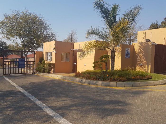 Top floor apartment in North Riding AH with balcony, security, and convenience. For Sale.