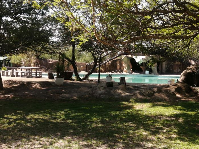 Kromdraai Farm For Sale: 10.9 hectares, game fenced, multiple chalets, lodge-ready amenities.