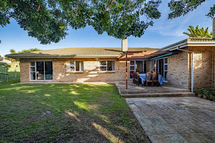 For Sale: House in Summerstrand with 4 bedrooms, garden, and outdoor braai area.