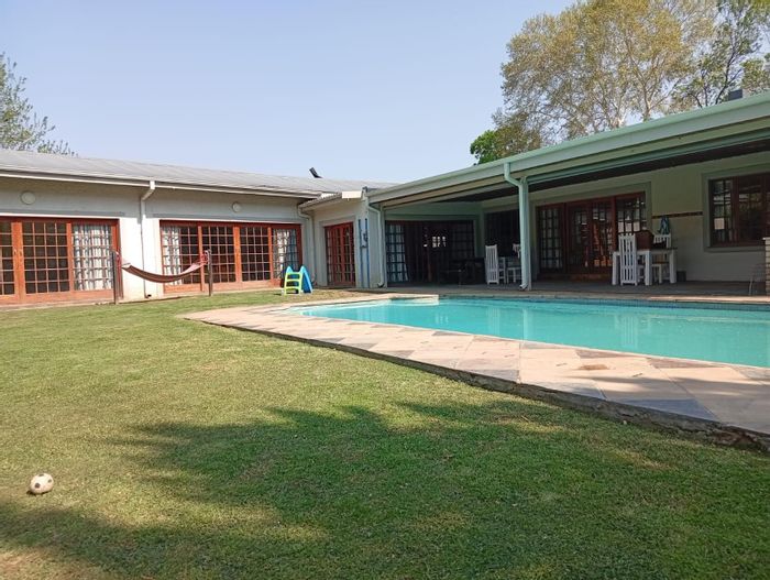 For Sale: Spacious 4-Bedroom House in Top Town with pool, garden, and office.