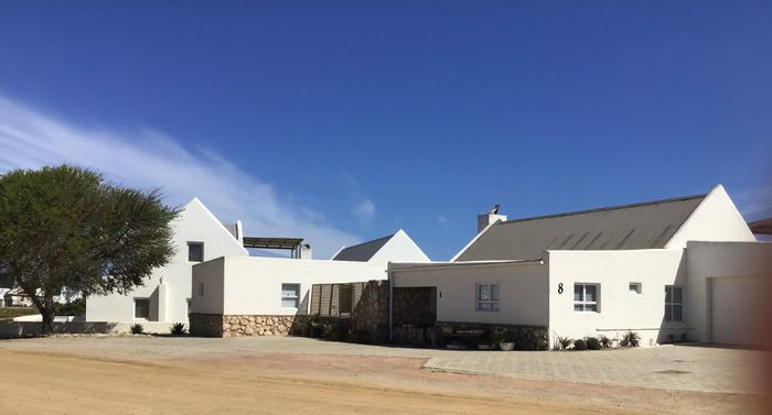 For Sale: House in Jacobsbaai with guest suites, pool, and rental income potential.
