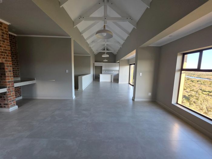 For Sale: House in Hartenbos Central with river views, garage, and secure estate.