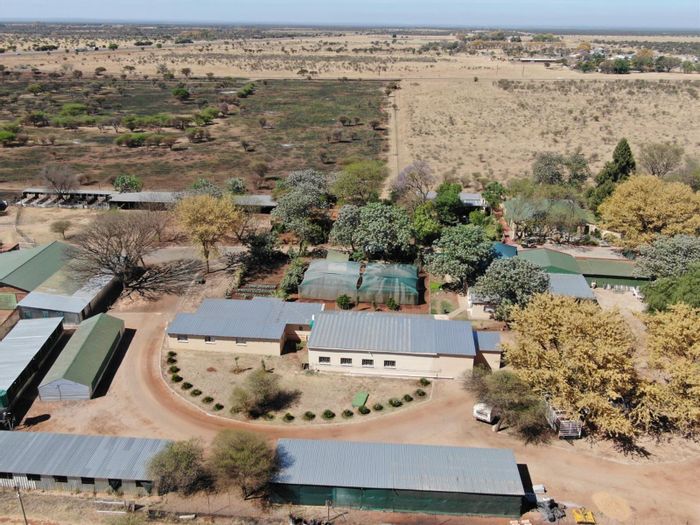 Radium Small Holding For Sale: Extensive farming infrastructure, multiple dwellings, investment potential.
