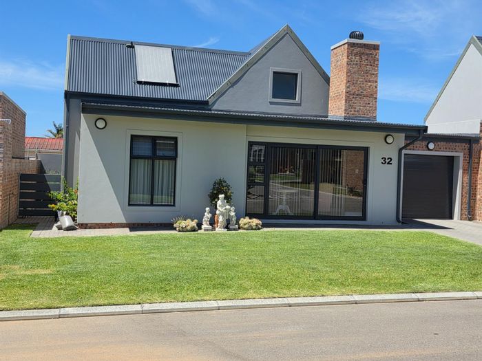 For Sale: House in Hartenbos Central with 2 beds, secure estate, and garden.