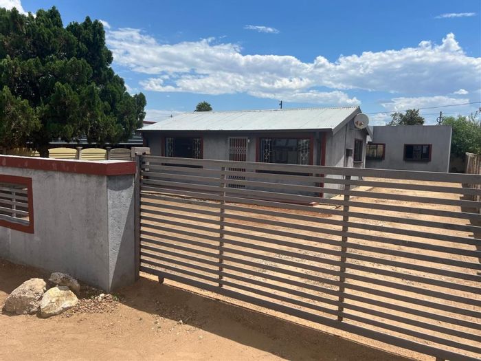 For Sale: House in Mmabatho with 2 bedrooms, bachelor flat, and rental income.