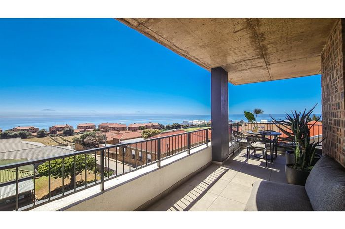For Sale: Apartment in Mossel Bay Central with sea views, wraparound balcony, and Airbnb potential.