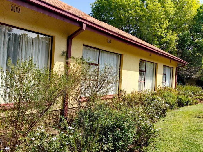 4-Bedroom House For Sale in Volksrust Central with garage, garden, and fireplace.