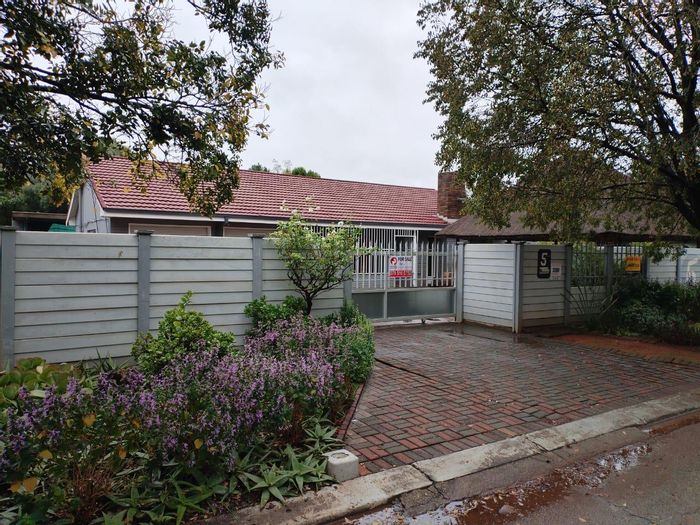 Spacious house in Stilfontein Central for sale, features workshop, braai room, and security.