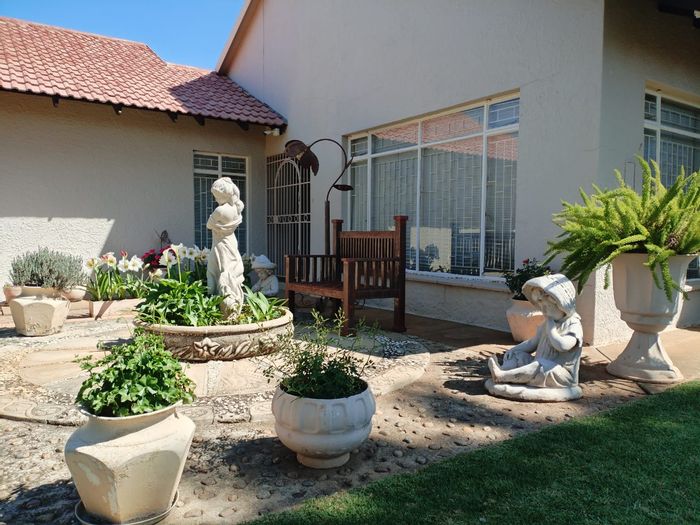 For Sale: Spacious 3-bedroom house in Stilfontein Central with security features and garden.