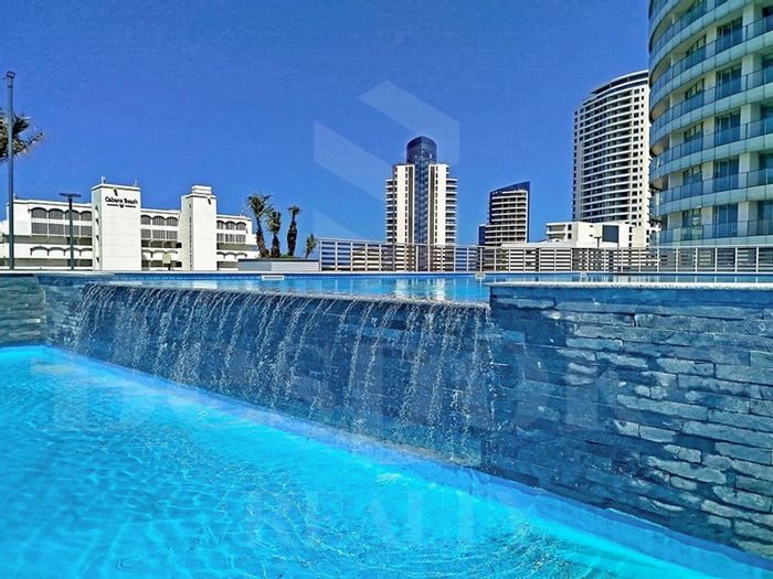 Umhlanga Central Apartment To Rent: Studio with ocean views, pool, and mall access.