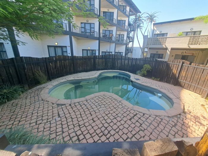 Furnished Bachelor Apartment To Rent in Maboneng with pool and laundromat access.